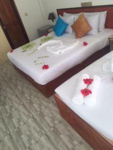 Postel nebo postele na pokoji v ubytování The Local Stay Maldives
