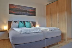 A bed or beds in a room at Landhaus Schneider