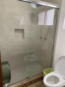 a bathroom with a glass shower with a toilet at Casa a Mallorca, a 3 cuadras del malecón La Paz in La Paz