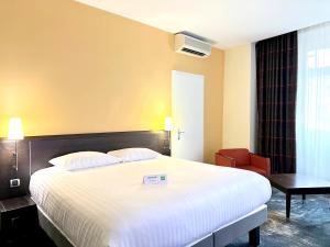 Postel nebo postele na pokoji v ubytování Ibis Styles Metz Centre Gare