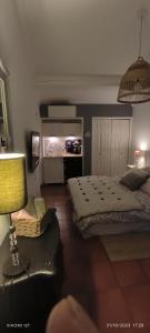 a bedroom with two beds and a flat screen tv at Villa féeric in Toulon