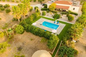an overhead view of a backyard with a swimming pool at Villa Elia with pool, Yurt and sea views in Kos Town