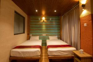 Tempat tidur dalam kamar di Everest Manla Resort