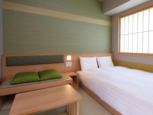 Un ou plusieurs lits dans un hébergement de l'établissement Beppu Hatto Onyado Nono Beppu