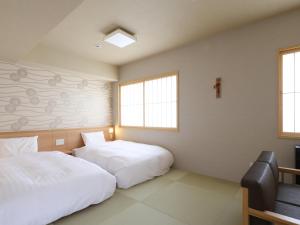 Un ou plusieurs lits dans un hébergement de l'établissement Beppu Hatto Onyado Nono Beppu