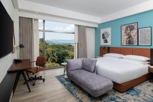 A bed or beds in a room at Four Points by Sheraton Kampala