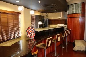 Kuchyň nebo kuchyňský kout v ubytování ロハスResort宮浦