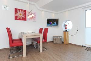 TV a/nebo společenská místnost v ubytování Residenz Hafenidyll