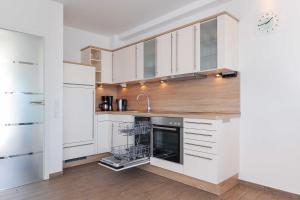 Kuchyň nebo kuchyňský kout v ubytování Residenz Hafenidyll