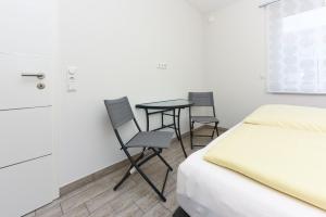 Postel nebo postele na pokoji v ubytování Residenz Hafenidyll