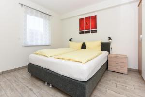 Postel nebo postele na pokoji v ubytování Residenz Hafenidyll
