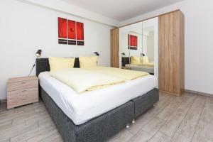 Postel nebo postele na pokoji v ubytování Residenz Hafenidyll