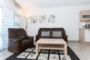 Kuchyň nebo kuchyňský kout v ubytování Residenz Hafenidyll