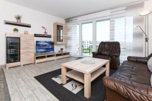 TV a/nebo společenská místnost v ubytování Residenz Hafenidyll