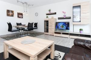 TV a/nebo společenská místnost v ubytování Residenz Hafenidyll