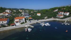 an aerial view of a harbor with boats in the water at Villa Cvita in Lumbarda