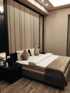 Postel nebo postele na pokoji v ubytování SOHO Hotel City Centre