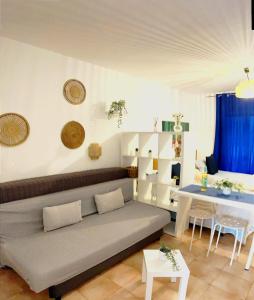 a living room with a couch and a table at Castle H 408 in Los Cristianos