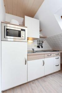 Kuchyň nebo kuchyňský kout v ubytování Haus Nordseesterne