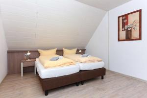 Postel nebo postele na pokoji v ubytování Haus Nordseesterne