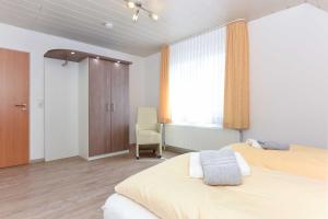 Postel nebo postele na pokoji v ubytování Haus Nordseesterne