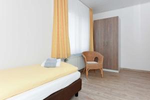 Postel nebo postele na pokoji v ubytování Haus Nordseesterne