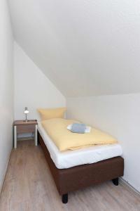 Postel nebo postele na pokoji v ubytování Haus Nordseesterne