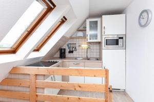 Kuchyň nebo kuchyňský kout v ubytování Haus Nordseesterne