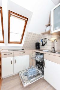 Kuchyň nebo kuchyňský kout v ubytování Haus Nordseesterne