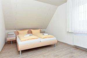 Postel nebo postele na pokoji v ubytování Haus Nordseesterne