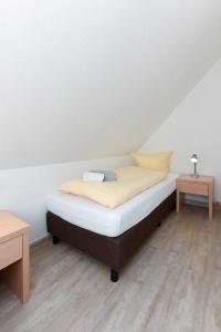 Postel nebo postele na pokoji v ubytování Haus Nordseesterne