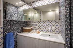 a bathroom with a sink and a mirror at Seaside Bungalow in Pefkochori +37 photos