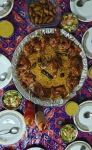 a table topped with a pie on a table at Tijan Siwa in Siwa