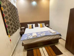 Postel nebo postele na pokoji v ubytování Tattva Paying guesthouse