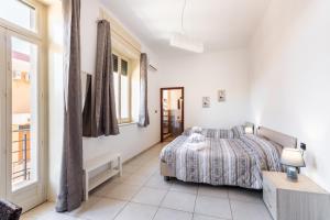 Posteľ alebo postele v izbe v ubytovaní Le Torrette Rooms and Apartments