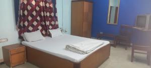 Katil atau katil-katil dalam bilik di HOTEL SHYAMALI AND EVENTS