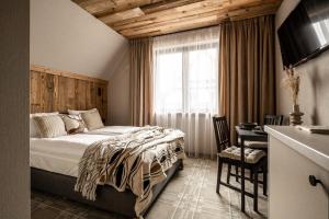 Posteľ alebo postele v izbe v ubytovaní ApartSki 18d