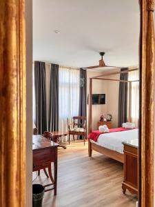 Postel nebo postele na pokoji v ubytování Convento Boutique Hotel