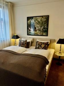 Postel nebo postele na pokoji v ubytování Park Hotel & Vinbar