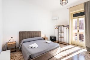 Posteľ alebo postele v izbe v ubytovaní Le Torrette Rooms and Apartments