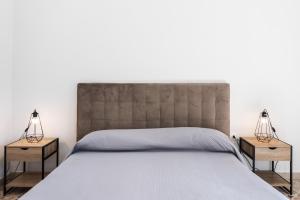 Posteľ alebo postele v izbe v ubytovaní Le Torrette Rooms and Apartments