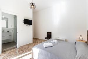 Posteľ alebo postele v izbe v ubytovaní Le Torrette Rooms and Apartments