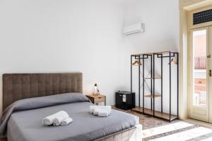Posteľ alebo postele v izbe v ubytovaní Le Torrette Rooms and Apartments