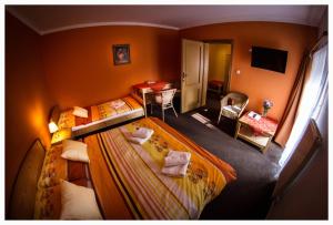 Posteľ alebo postele v izbe v ubytovaní Horský Hotel Sněženka