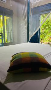 Postel nebo postele na pokoji v ubytování Kataragama Homestay