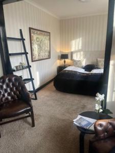 Voodi või voodid majutusasutuse Park Hotel & Vinbar toas