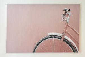 a bike parked next to a pink wall at U Studanky CR Apartments in Prague