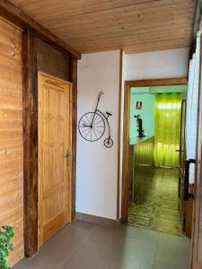 a hallway with a room with a bike on the wall at Hostal Cabañeros in Ciudad Real