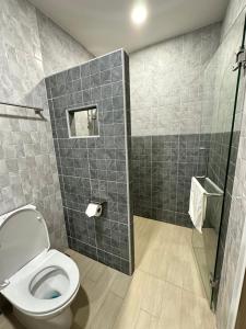 a bathroom with a toilet and a shower at Kata Noi Place in Kata Beach