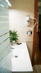 a white counter in a room with a camera at Sweet Roman Holiday in Fiumicino